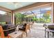 Outdoor screened pool features multiple seating and dining areas at 1327 Hedgewood Cir, North Port, FL 34288