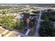 Beautiful aerial view of a landscaped property, pinpointing the house in a lush, green neighborhood at 14534 Keene Ave, Port Charlotte, FL 33953