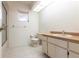 Bright bathroom with a sink, toilet, and shower at 14534 Keene Ave, Port Charlotte, FL 33953