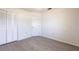 This bedroom features wood flooring, a closet, and a neutral color scheme at 14534 Keene Ave, Port Charlotte, FL 33953