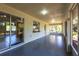 Large enclosed lanai offering ample space and views of the surrounding lush greenery at 14534 Keene Ave, Port Charlotte, FL 33953