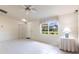Open living room with tile floors and a view of the outdoors at 14534 Keene Ave, Port Charlotte, FL 33953