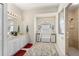 Bathroom featuring double vanity, decorative rug, and glass-enclosed shower at 1513 Urmey Ln, North Port, FL 34286