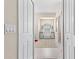 Inviting foyer with decorative rug, arched window, and ample natural light at 1513 Urmey Ln, North Port, FL 34286