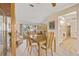 Bright dining area with large window offering a view, seamlessly connecting to the living space at 158 Norman St, Port Charlotte, FL 33954