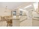 Bright kitchen with granite counters, skylight, tile floors, and view of the pool at 158 Norman St, Port Charlotte, FL 33954