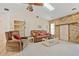 Cozy living room featuring a ceiling fan, skylight, and comfortable seating at 158 Norman St, Port Charlotte, FL 33954