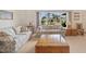 Bright living room with large windows, comfortable seating, and a warm ambiance at 158 Norman St, Port Charlotte, FL 33954