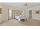 Main bedroom featuring a ceiling fan, carpet floors, and a bay window at 158 Norman St, Port Charlotte, FL 33954