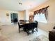 Elegant dining area with a chandelier and a table with seating for six at 16909 Caracara Pl, Punta Gorda, FL 33982