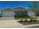Charming single-story home with a two-car garage and well-maintained landscaping at 16909 Caracara Pl, Punta Gorda, FL 33982