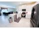 Modern kitchen featuring white cabinets, stainless steel appliances, and an open layout at 16909 Caracara Pl, Punta Gorda, FL 33982