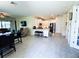 Open concept kitchen with white cabinets, stainless steel appliances, and a breakfast bar at 16909 Caracara Pl, Punta Gorda, FL 33982