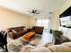 Bright living room with a ceiling fan and comfortable seating area at 16909 Caracara Pl, Punta Gorda, FL 33982