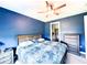 Cozy main bedroom with a ceiling fan and an ensuite bathroom at 16909 Caracara Pl, Punta Gorda, FL 33982