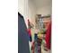 Linen closet with multiple shelves storing a variety of household and cleaning items at 16909 Caracara Pl, Punta Gorda, FL 33982