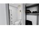 Bright bathroom with a toilet, closet, and decorative flower for a serene and organized space at 22498 Westchester Blvd, Punta Gorda, FL 33980