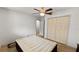 The bedroom includes tile flooring, a ceiling fan, double closets, and neutral walls, providing a versatile space at 22498 Westchester Blvd, Punta Gorda, FL 33980