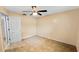 This cozy bedroom features tile floors, ceiling fan, and a convenient closet, offering a comfortable space at 22498 Westchester Blvd, Punta Gorda, FL 33980