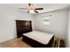 This bedroom offers tile flooring, a window, and a stylish headboard, creating a cozy and inviting atmosphere at 22498 Westchester Blvd, Punta Gorda, FL 33980