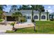 Charming single-story home with a well-manicured lawn, lush landscaping, and an attached two-car garage at 22498 Westchester Blvd, Punta Gorda, FL 33980