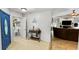 Inviting foyer with a blue front door and console table leading to the living room at 22498 Westchester Blvd, Punta Gorda, FL 33980
