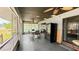 Screened porch features a dining set and refrigerator, perfect for outdoor dining and relaxation at 22498 Westchester Blvd, Punta Gorda, FL 33980