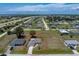 Wide aerial panorama featuring the property set among a quiet residential area at 25046 Doredo Dr, Punta Gorda, FL 33955