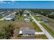 Elevated aerial view of the house showing its position within a spread-out residential community at 25046 Doredo Dr, Punta Gorda, FL 33955