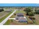 Expansive aerial view showcasing the home's location within a well-developed neighborhood at 25046 Doredo Dr, Punta Gorda, FL 33955