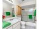 Bathroom featuring a shower-tub combo, a cabinet and a single sink vanity at 25046 Doredo Dr, Punta Gorda, FL 33955