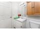 Bright bathroom featuring a white sink, vanity, mirror, and medicine cabinet for storage at 25046 Doredo Dr, Punta Gorda, FL 33955