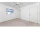 This bedroom has neutral carpeting, a ceiling fan, and a closet for storage space at 25046 Doredo Dr, Punta Gorda, FL 33955