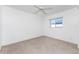 This is a bedroom featuring neutral carpeting and a ceiling fan for added comfort at 25046 Doredo Dr, Punta Gorda, FL 33955