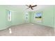 Bright bedroom with large windows allowing for lots of natural light and neutral carpet at 25046 Doredo Dr, Punta Gorda, FL 33955