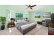 A primary bedroom with a neutral color palette, area rug, and stylish furnishings at 25046 Doredo Dr, Punta Gorda, FL 33955