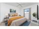 This is a staged bedroom with a queen sized bed, side tables, lamps and decorative elements at 25046 Doredo Dr, Punta Gorda, FL 33955