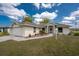 Charming single-story home with well-maintained landscaping and an attached two-car garage at 25046 Doredo Dr, Punta Gorda, FL 33955