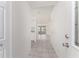 Inviting foyer with neutral tile flooring and a clear view to the living area at 25046 Doredo Dr, Punta Gorda, FL 33955