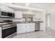 Well-equipped kitchen featuring stainless steel appliances, granite countertops, and bright lighting at 25046 Doredo Dr, Punta Gorda, FL 33955