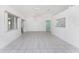 Bright living room with tile flooring, modern fixtures, and open views of other rooms at 25046 Doredo Dr, Punta Gorda, FL 33955