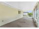 Enclosed patio features carpeting and an exterior view at 25046 Doredo Dr, Punta Gorda, FL 33955