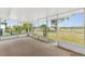 This is a large, screened patio with a view of the fenced backyard at 25046 Doredo Dr, Punta Gorda, FL 33955