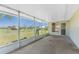 This is a large enclosed patio that overlooks a manicured lawn at 25046 Doredo Dr, Punta Gorda, FL 33955