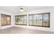Sunroom featuring tiled floors, a ceiling fan, and large windows offering natural light and backyard views at 25046 Doredo Dr, Punta Gorda, FL 33955