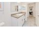 Bright bathroom with a single sink vanity and neutral decor at 25324 Aysen Dr, Punta Gorda, FL 33983