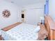 Inviting bedroom showcasing closet, decor, and view into the hall at 25324 Aysen Dr, Punta Gorda, FL 33983