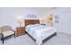 Serene bedroom with wood furnishings, a queen bed, and artwork, creating a relaxing atmosphere at 25324 Aysen Dr, Punta Gorda, FL 33983