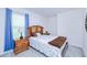 Cozy bedroom with a wooden headboard, side tables and decor at 25324 Aysen Dr, Punta Gorda, FL 33983