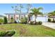 Charming single Gathering home with a well maintained lawn, beautiful landscaping and a two car garage at 25324 Aysen Dr, Punta Gorda, FL 33983